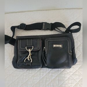 The Sak Black Pebbled Leather Fanny Pack Crossbody Bag with Adjustable Strap.